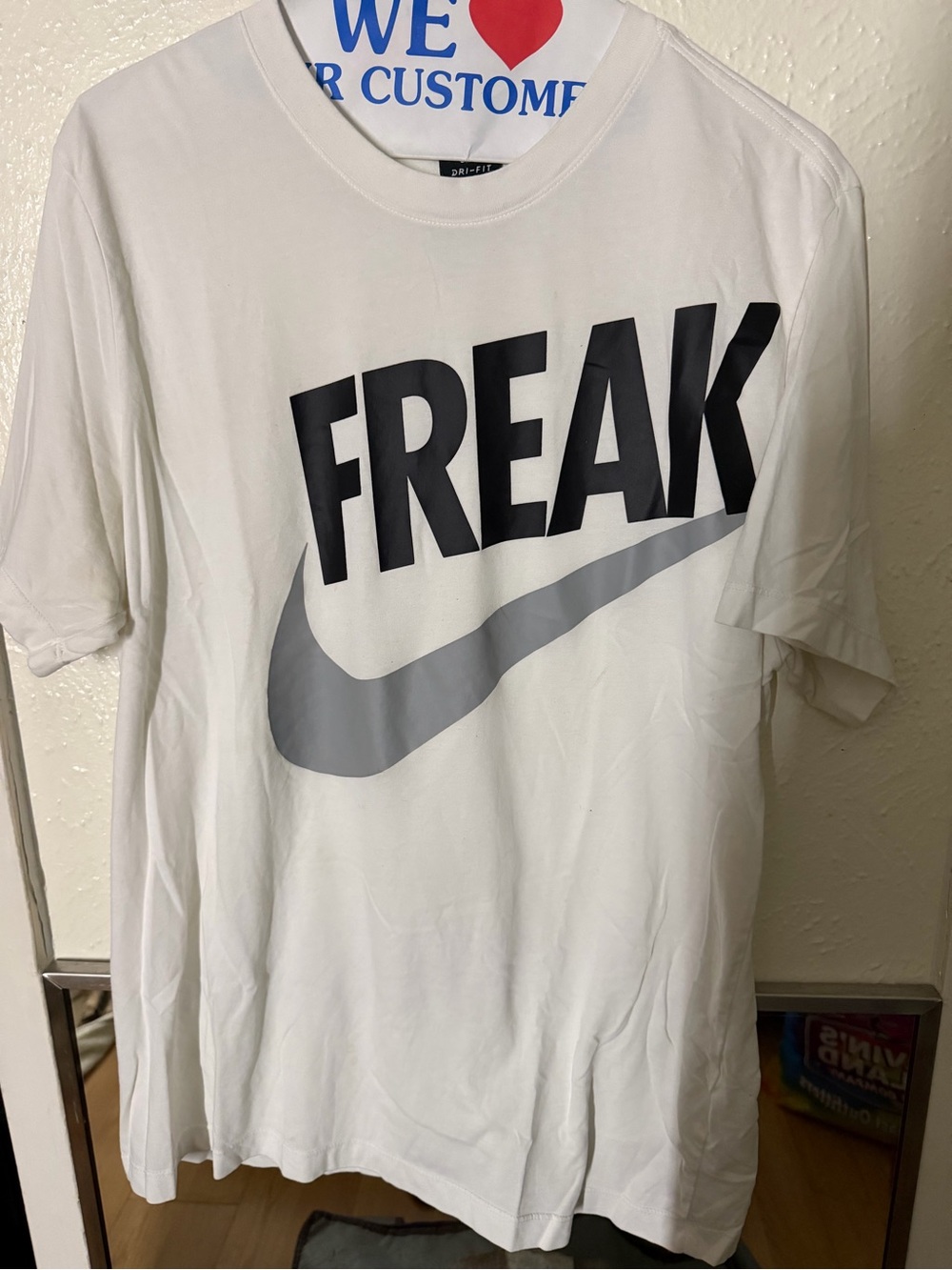 Nike White Short Sleeve Tee with Black "FREAK" Text and Gray Swoosh